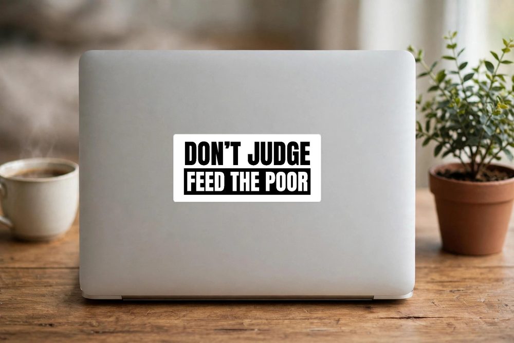 White Don’t Judge sticker on a silver laptop lid